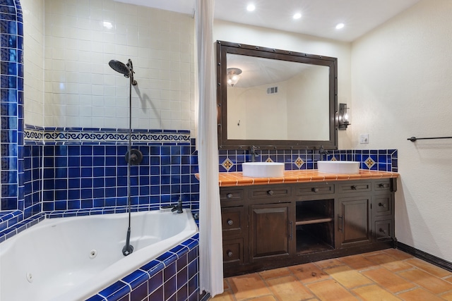 bathroom with vanity and independent shower and bath