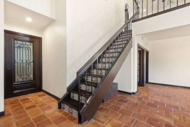 foyer entrance featuring a high ceiling