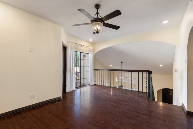 unfurnished room featuring ceiling fan and dark hardwood / wood-style flooring