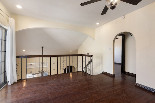 unfurnished room with dark wood-type flooring and ceiling fan