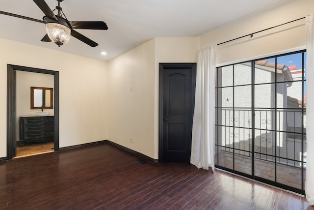 interior space featuring ceiling fan and dark hardwood / wood-style floors