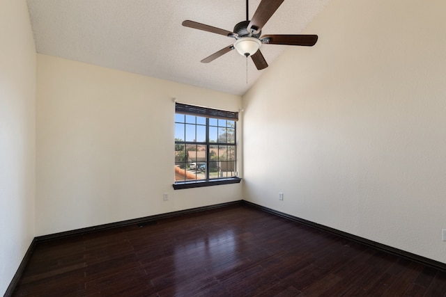 unfurnished room with lofted ceiling, dark hardwood / wood-style floors, a textured ceiling, and ceiling fan