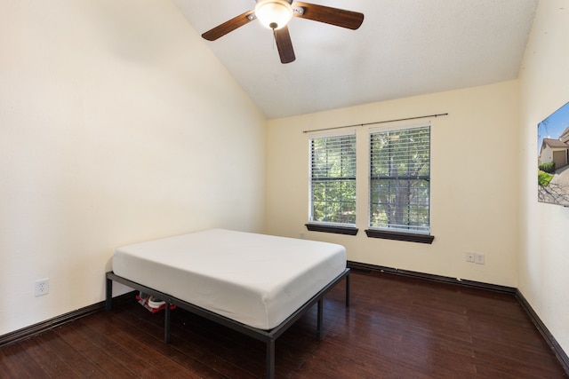 bedroom featuring ceiling fan, high vaulted ceiling, and dark hardwood / wood-style flooring