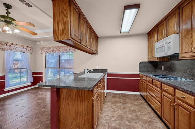 kitchen featuring ceiling fan, white appliances, sink, backsplash, and light tile patterned floors