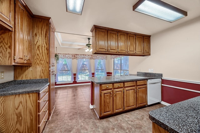 kitchen with ceiling fan, light tile patterned flooring, kitchen peninsula, and dishwasher