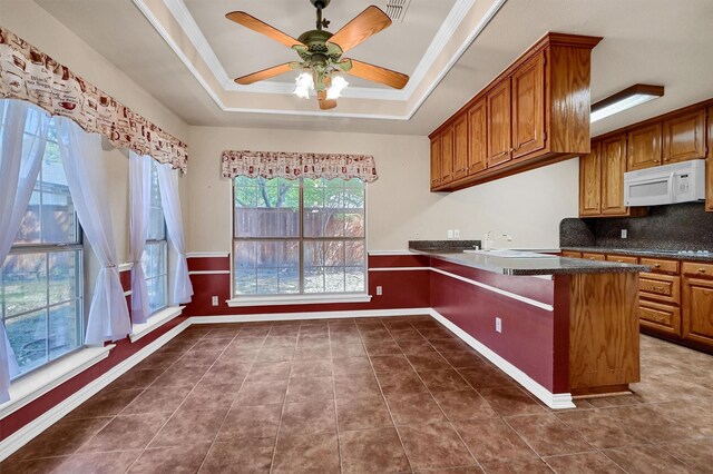 washroom with washer hookup, cabinets, light tile patterned floors, and hookup for an electric dryer