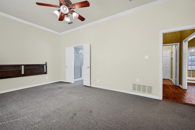 carpeted spare room with ceiling fan and ornamental molding