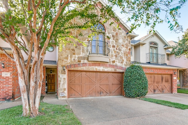 view of front of home with a balcony and a garage