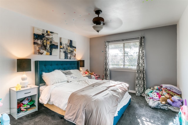 bedroom featuring ceiling fan and dark colored carpet