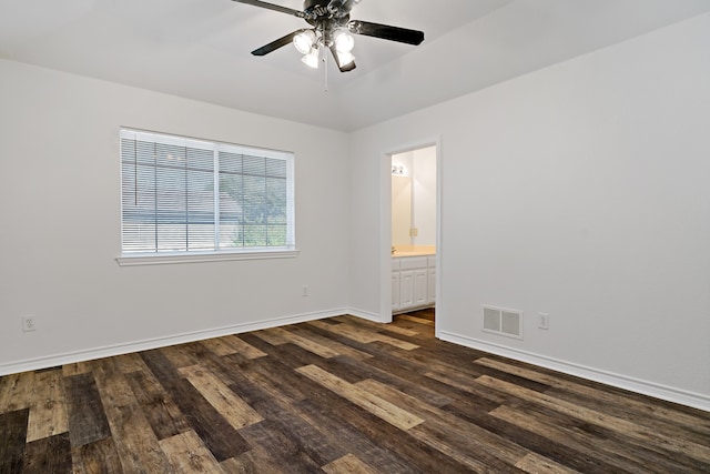 unfurnished room featuring ceiling fan and dark hardwood / wood-style flooring