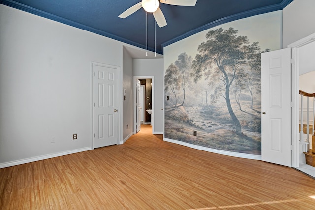 spare room with ceiling fan, hardwood / wood-style flooring, and ornamental molding