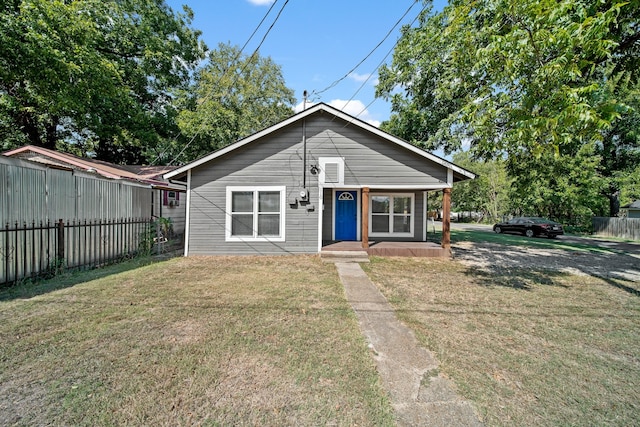 bungalow-style house featuring a front yard