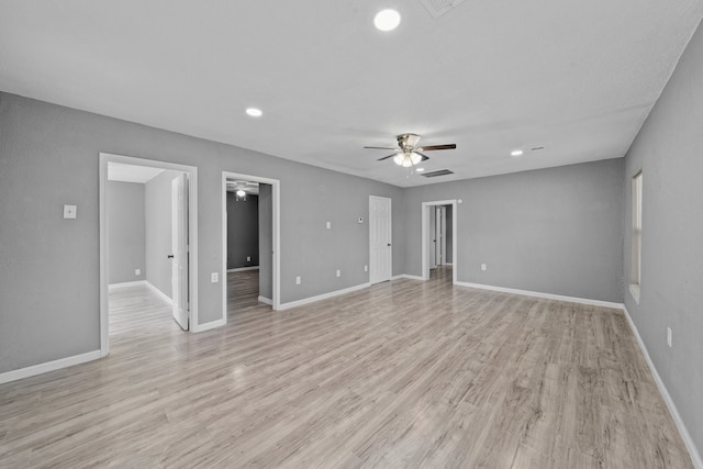 unfurnished living room featuring light hardwood / wood-style flooring and ceiling fan