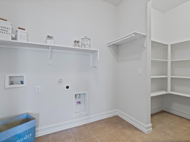 clothes washing area with washer hookup, hookup for a gas dryer, light tile patterned floors, and electric dryer hookup