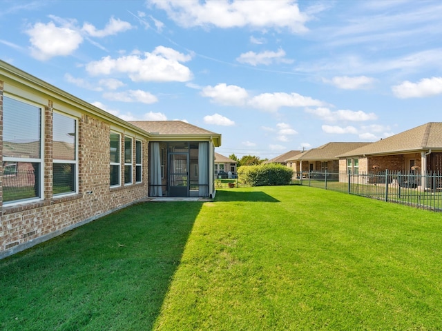 view of yard featuring a sunroom