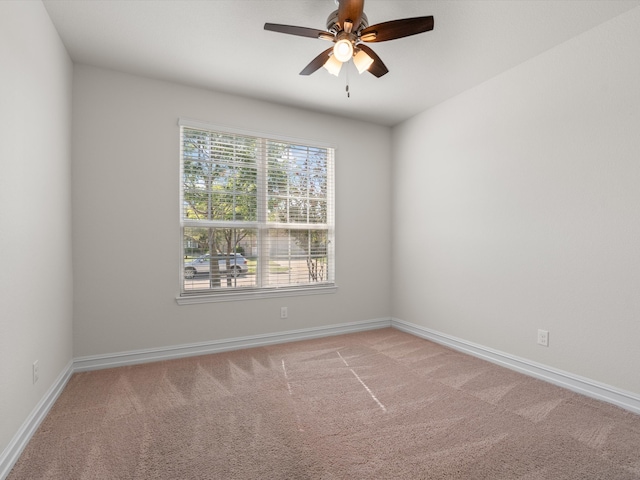 unfurnished room with light carpet and ceiling fan