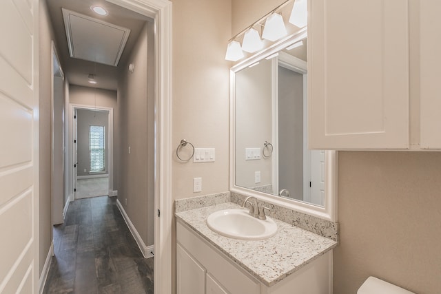 bathroom with vanity and hardwood / wood-style floors