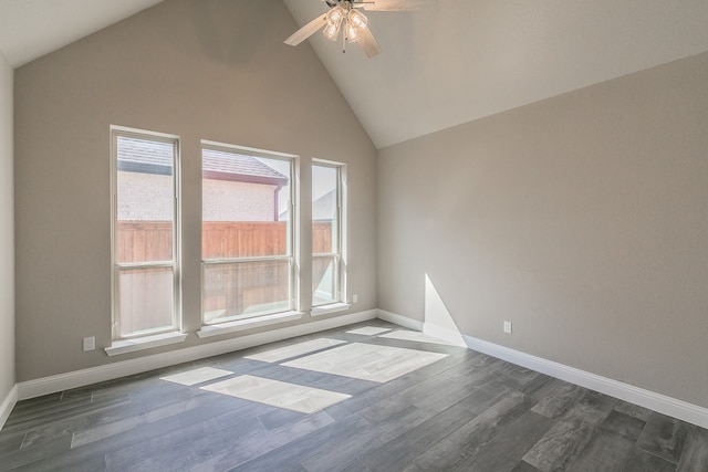 unfurnished room featuring dark wood-type flooring, high vaulted ceiling, and ceiling fan