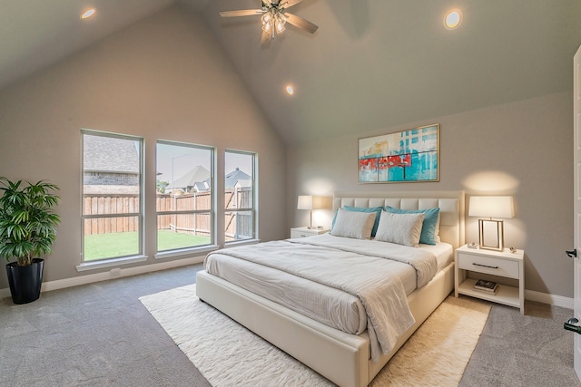 bedroom featuring light carpet, high vaulted ceiling, and ceiling fan