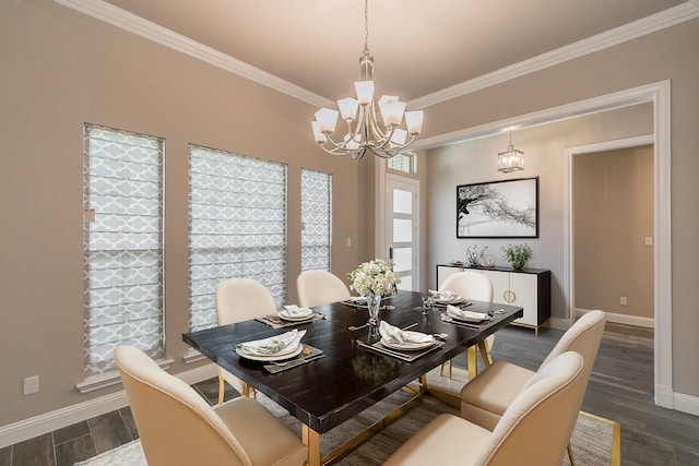 dining room with dark wood-type flooring and crown molding