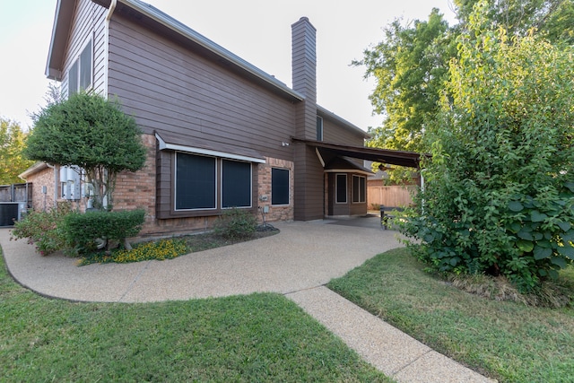 rear view of house with a lawn