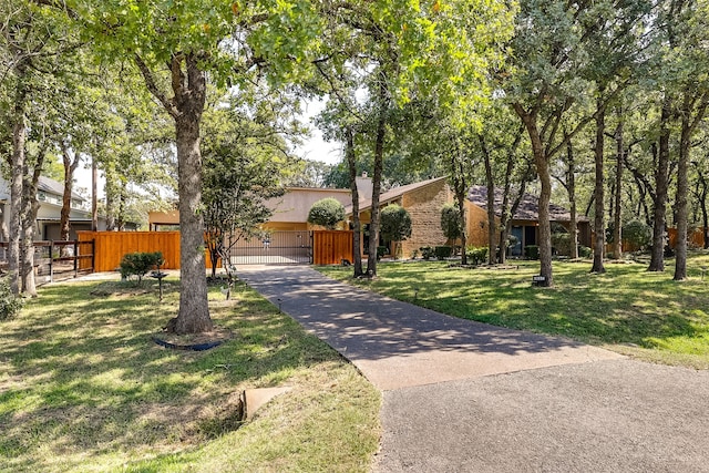 view of front of home featuring a front lawn and a garage