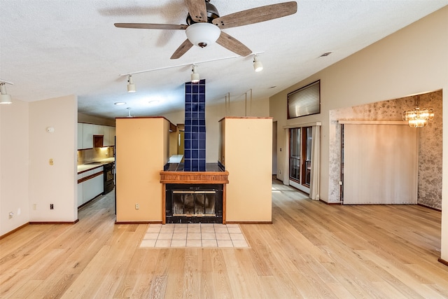 kitchen featuring light wood-type flooring and a textured ceiling