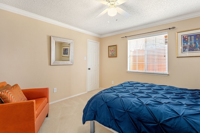 bedroom with ornamental molding, light colored carpet, a textured ceiling, and ceiling fan