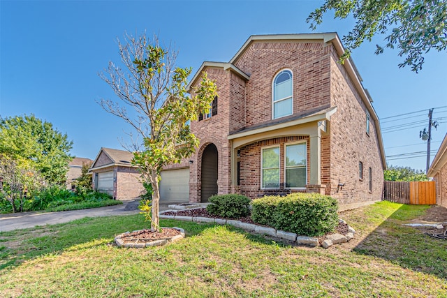 view of property with a front yard and a garage