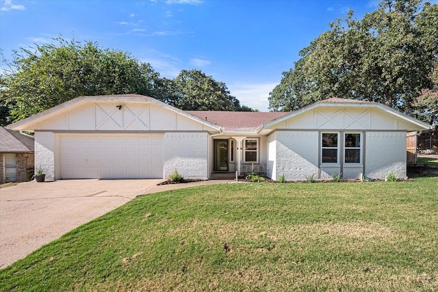 single story home featuring a garage and a front lawn