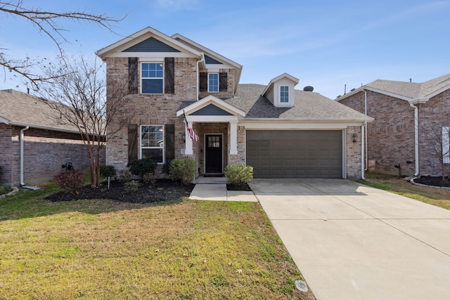 view of front of home with a front yard and a garage