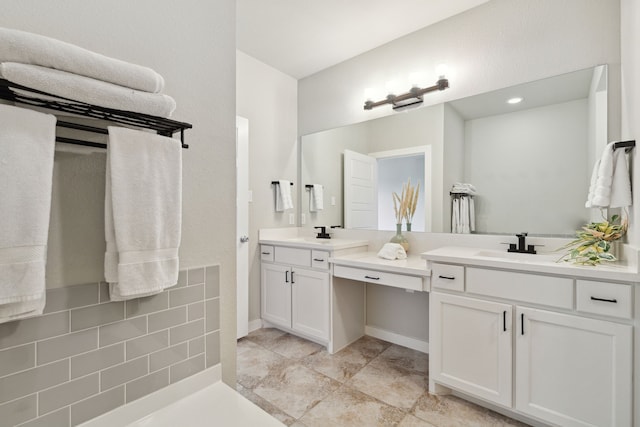 bathroom featuring tile patterned flooring and vanity