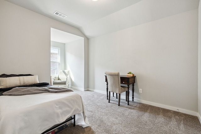 carpeted bedroom featuring vaulted ceiling