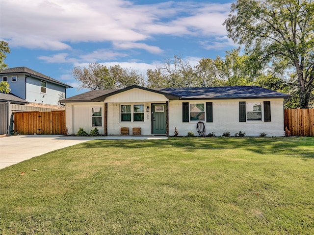 ranch-style home with a front yard