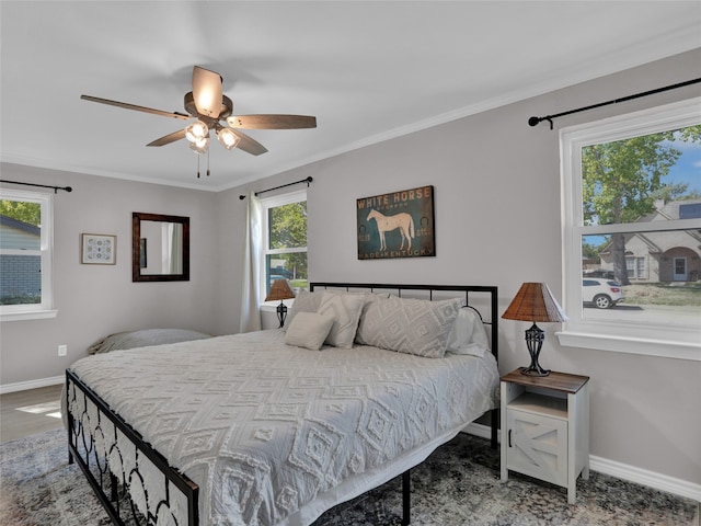 bedroom featuring ornamental molding and ceiling fan