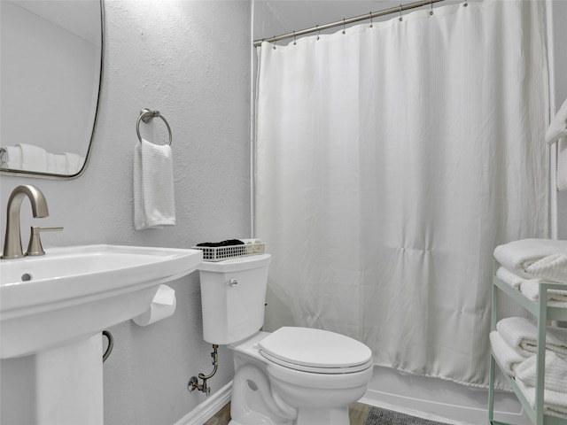 bathroom with sink and toilet