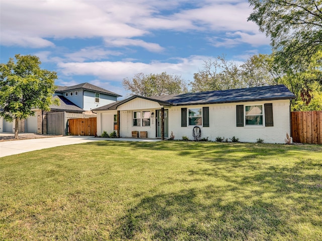 ranch-style house with a garage and a front lawn