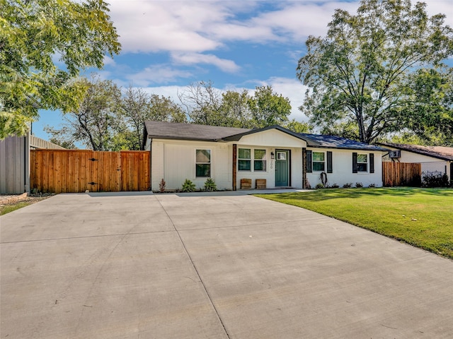 ranch-style house with a front yard