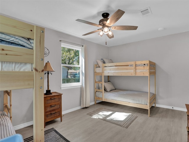 bedroom featuring ceiling fan and light hardwood / wood-style flooring