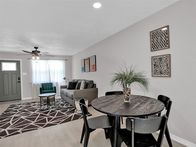 dining area featuring ceiling fan and wood-type flooring