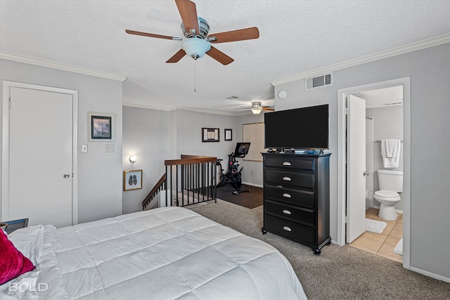 bedroom with a textured ceiling, ceiling fan, connected bathroom, crown molding, and carpet flooring