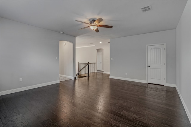 empty room with dark hardwood / wood-style floors and ceiling fan