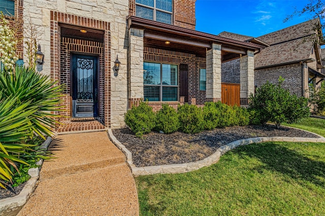 doorway to property featuring a yard