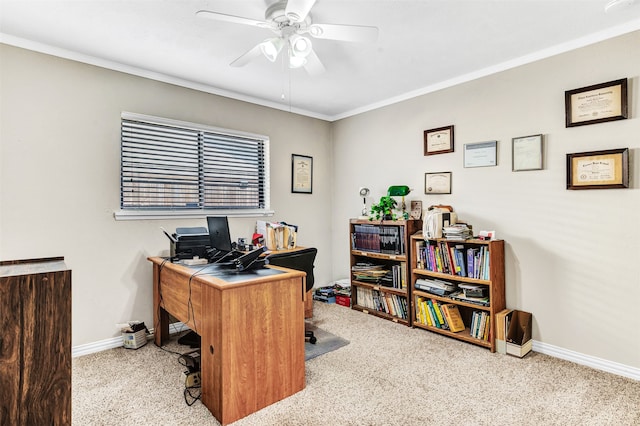 carpeted office with crown molding and ceiling fan