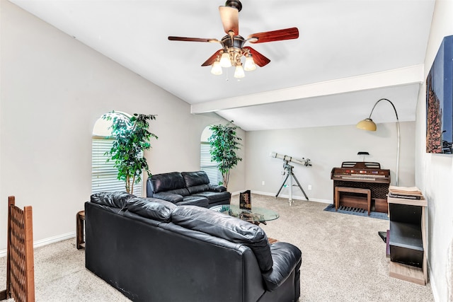 living room featuring ceiling fan, vaulted ceiling with beams, and light colored carpet