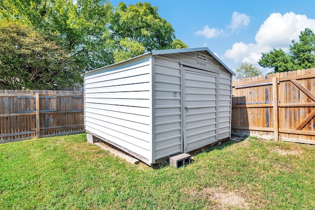 view of outdoor structure with a lawn