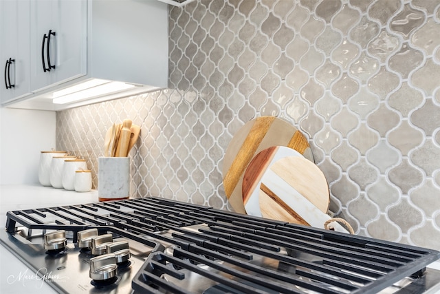 room details with tasteful backsplash and stainless steel gas stovetop