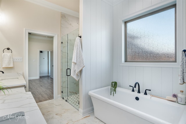 bathroom with vanity, ornamental molding, and shower with separate bathtub