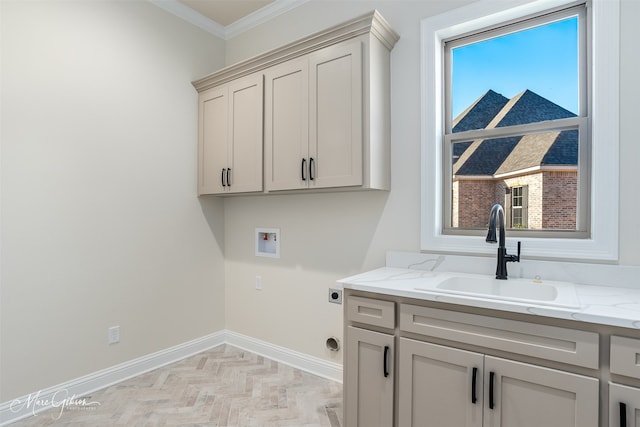 clothes washing area featuring cabinets, washer hookup, ornamental molding, electric dryer hookup, and sink