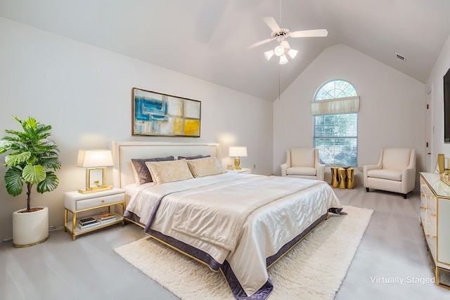 carpeted bedroom with ceiling fan and lofted ceiling